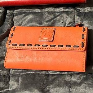 Dooney and Bourke Florentine continental clutch in salmon